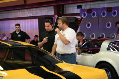 Ryan discussing the custom features and components on the 1966 Fastback with the show's MC.